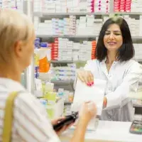 Woman collecting pharmacy prescription